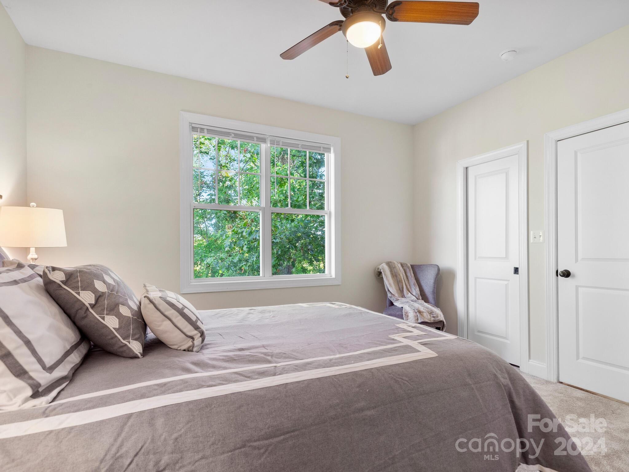 9 Forest Spring Drive Asheville, NC 28804 - Photo 22 of 42 a bedroom with a bed and window