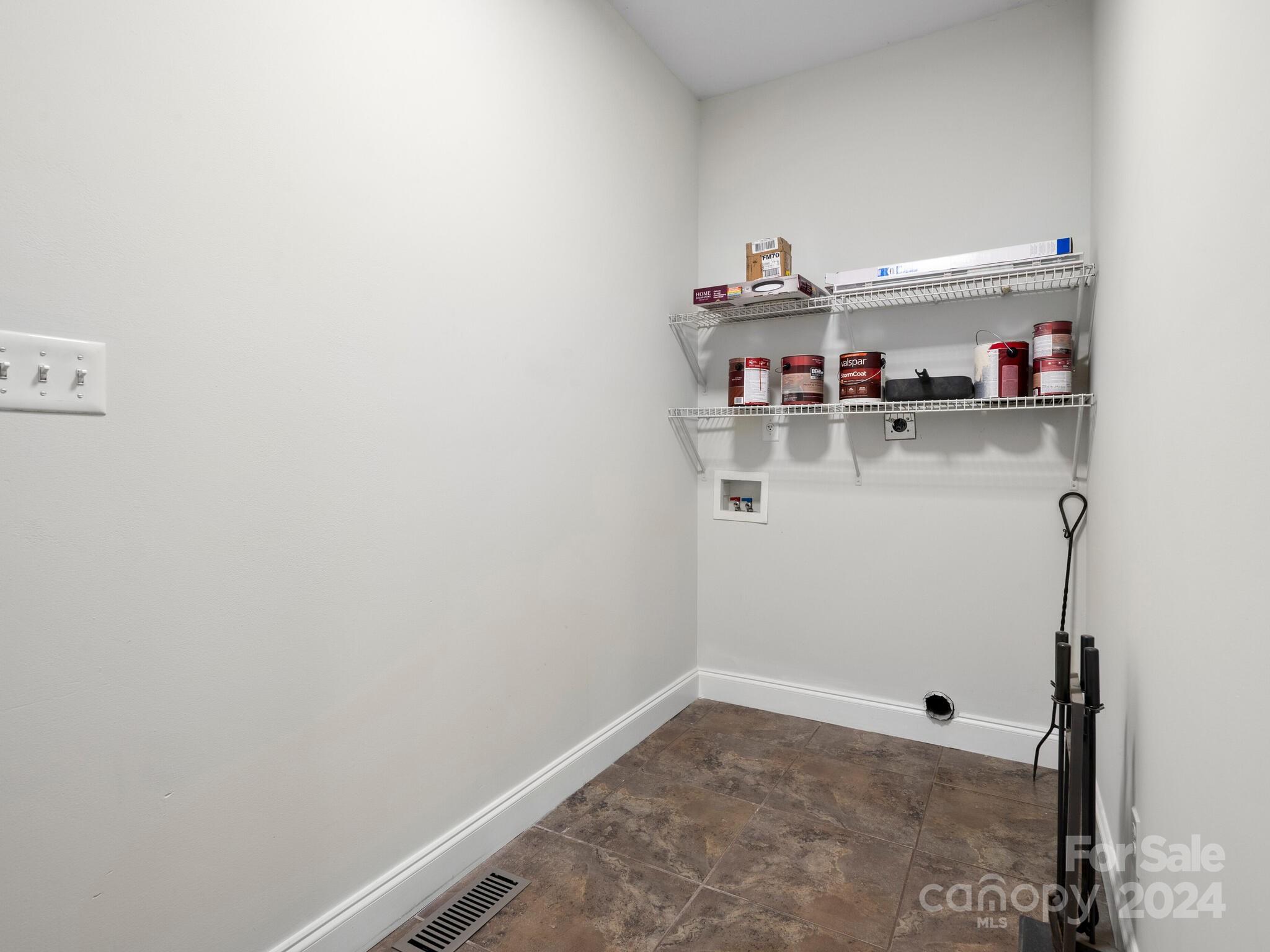 9 Forest Spring Drive Asheville, NC 28804 - Photo 36 of 42 a room with water heater and white cabinets