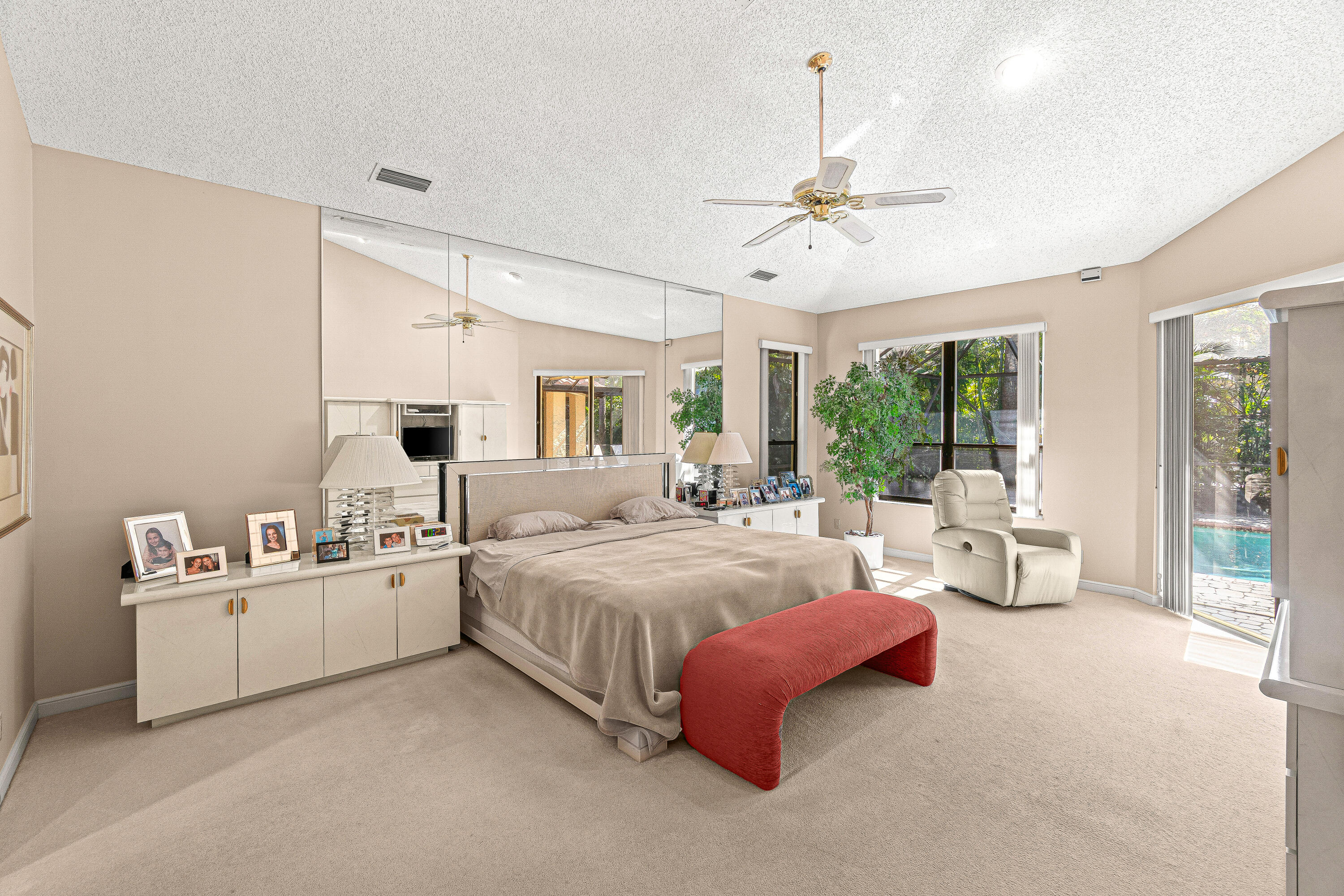 2250 Northwest 59th Street Boca Raton, FL 33496 - Photo 12 of 22 a spacious bedroom with a bed couch and large window with view of living room