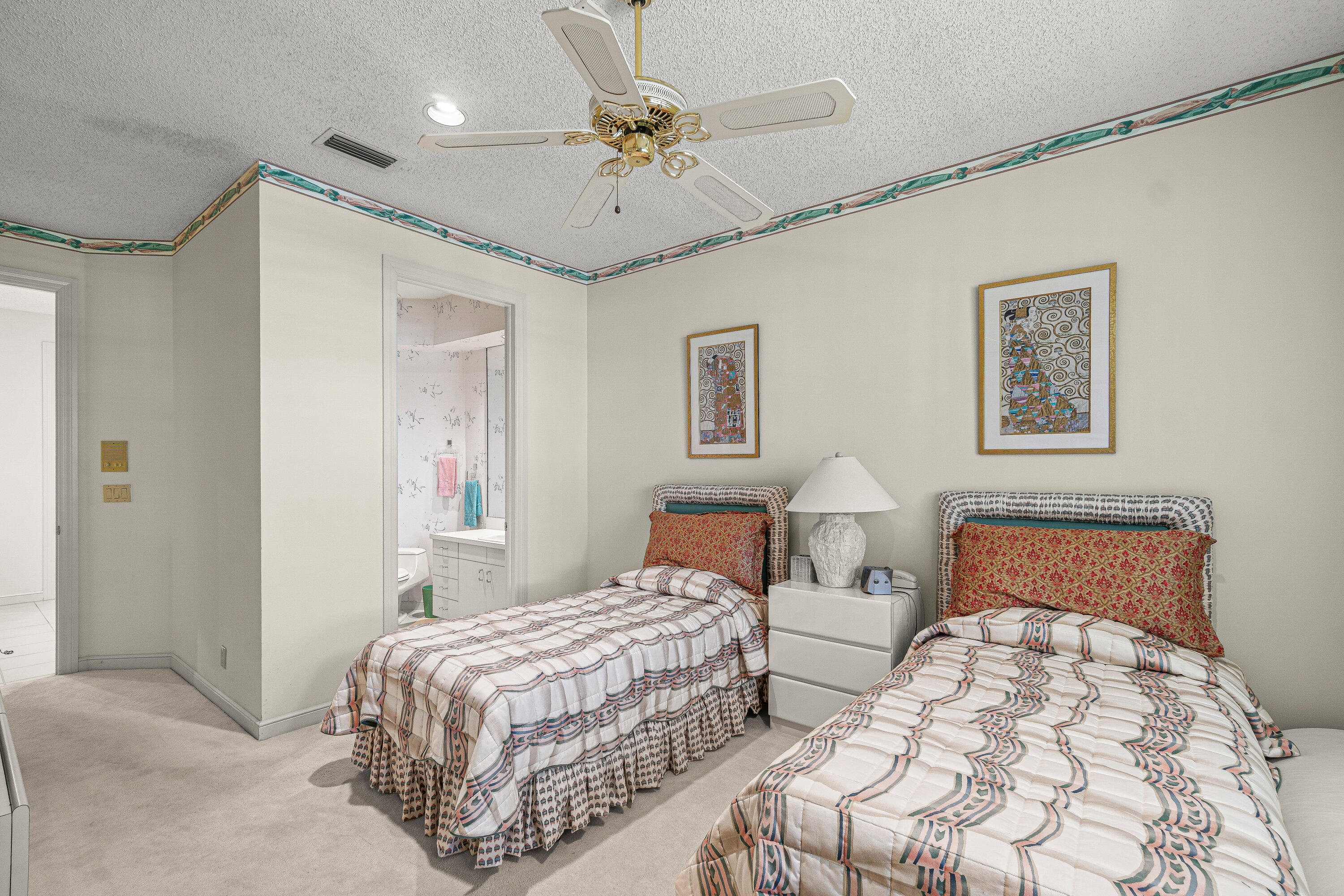 2250 Northwest 59th Street Boca Raton, FL 33496 - Photo 18 of 22 a bedroom with two beds and painting on the wall