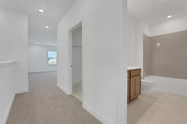 a view of a hallway with closet