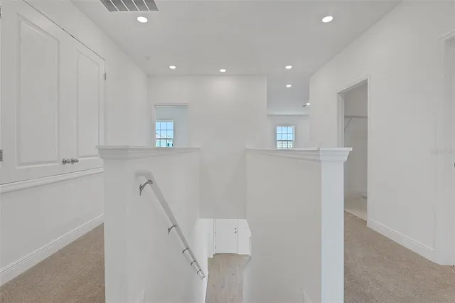 a view of hallway with stairs