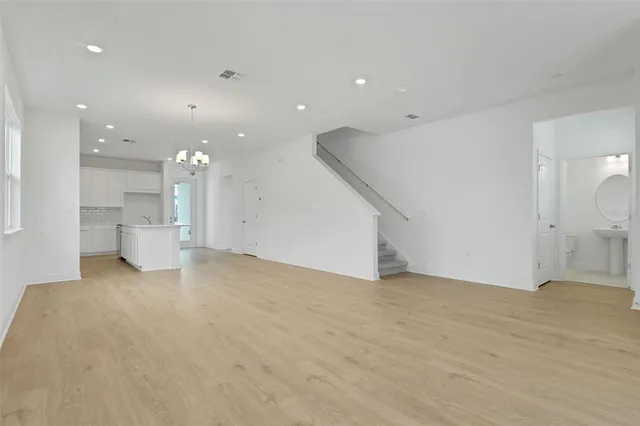 a view of a big room with a kitchen
