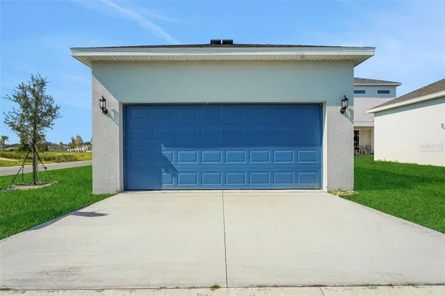 a view of a house with a garage