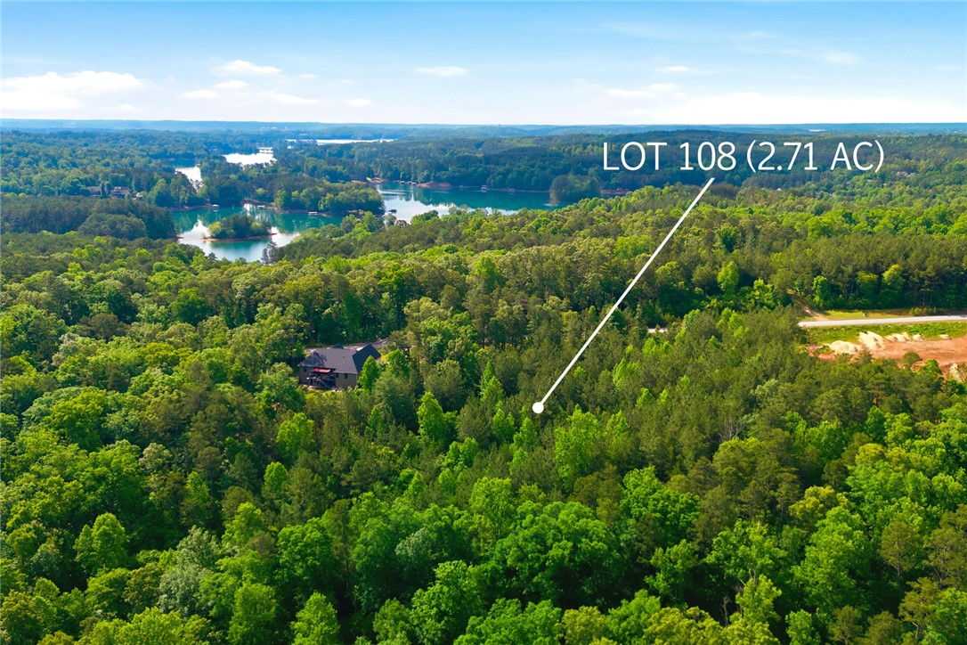 Lot 108 Harbor Ridge Road Seneca, SC 29672 - Photo 13 of 13 This aerial view showcases a lush, wooded lot with picturesque water views, offering serene natural surroundings.