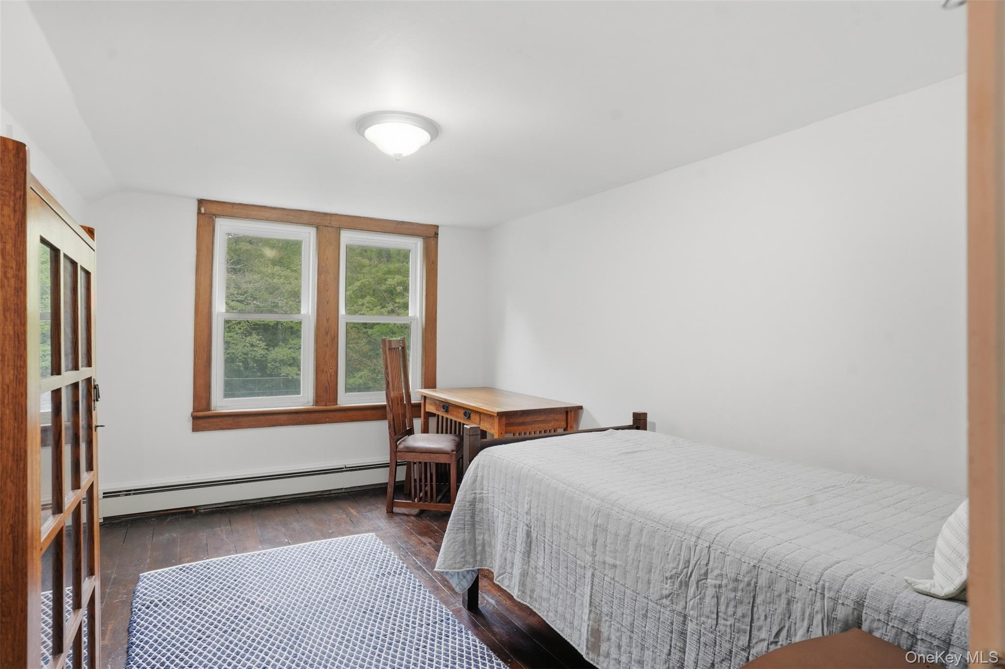 726 Wittenberg Road Mount Tremper, NY 12457 - Photo 21 of 32 a bed sitting in a bedroom next to a window