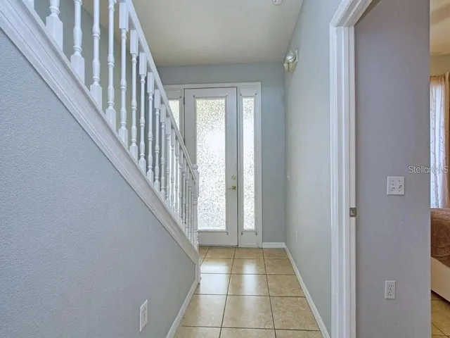 a view of a hallway with a front door
