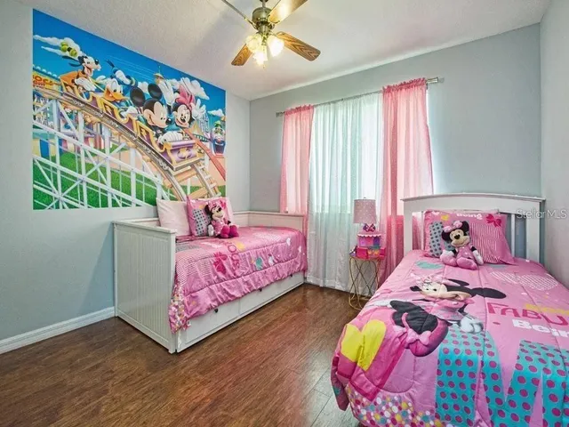 a bedroom with bed and a window