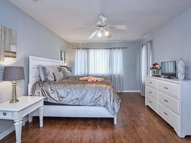 a bedroom with a bed and a dresser