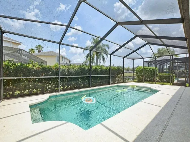 a view of a backyard with a garden and plants