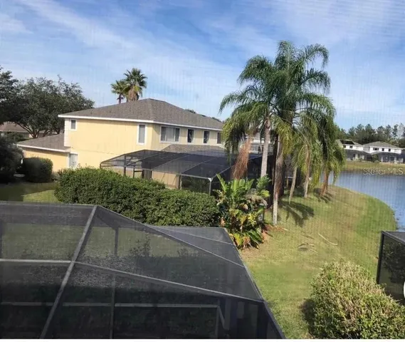 a view of a swimming pool with a garden