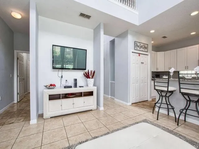 a view of kitchen with furniture and flat screen tv