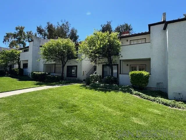 a view of a patio with table and chairs and potted plants