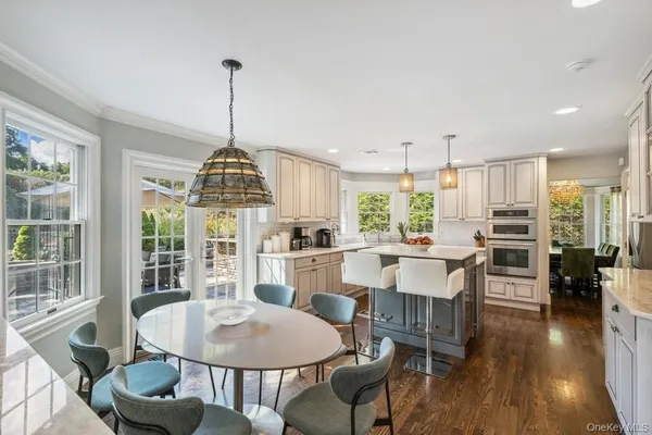 a dining room with furniture window wooden floor