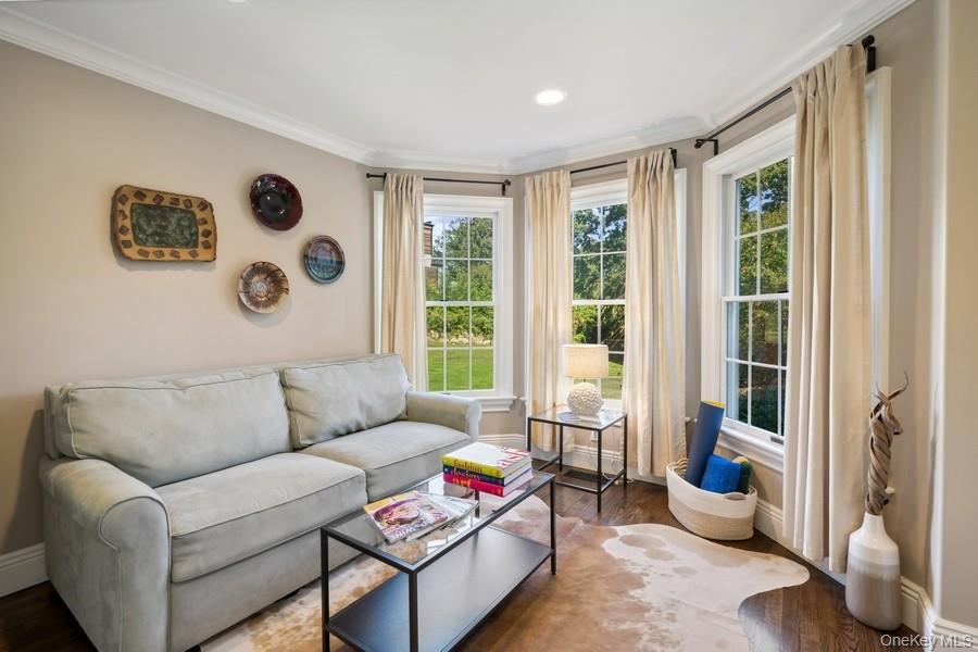 39 Smugglers Path Riverhead, NY 11901 - Photo 15 of 47 a living room with furniture and a large window