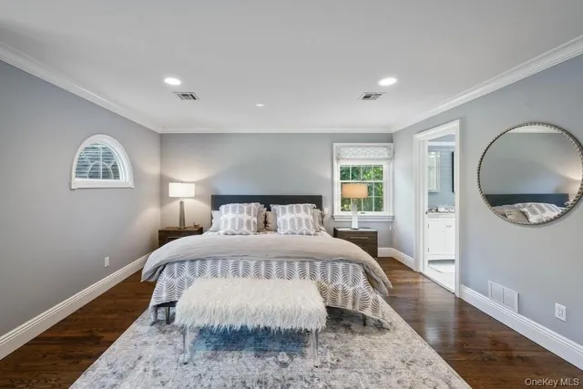 a bedroom with a large bed and a couch