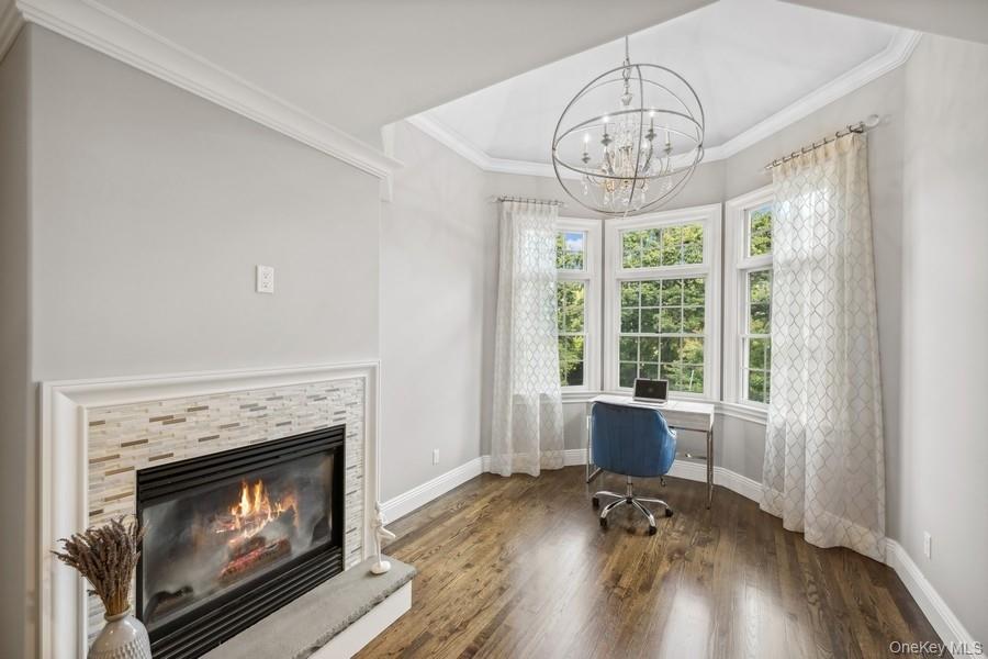 39 Smugglers Path Riverhead, NY 11901 - Photo 20 of 47 a living room with furniture and a fireplace