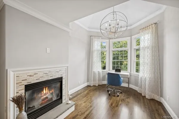 a bedroom with a large bed and a view of living room