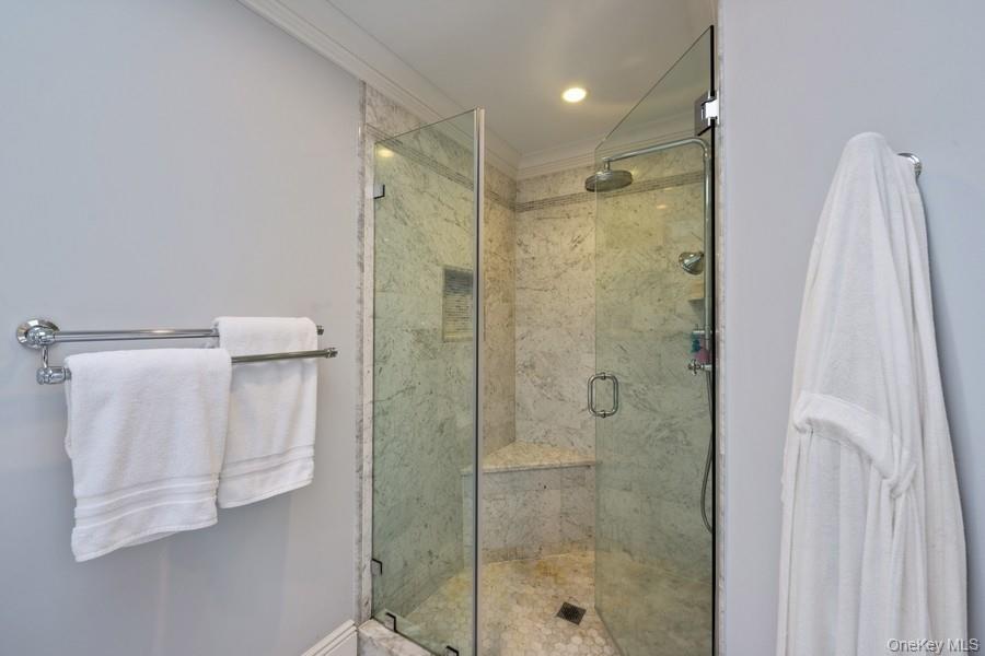 39 Smugglers Path Riverhead, NY 11901 - Photo 25 of 48 a bathroom with a shower and a mirror