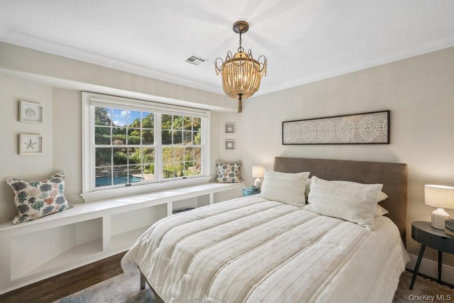 39 Smugglers Path Riverhead, NY 11901 - Photo 26 of 48 a bedroom with a large bed and a window