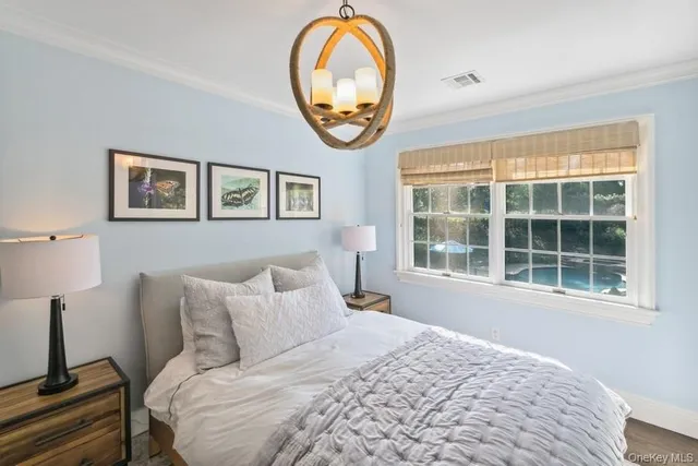 a bed room with a bed and a window