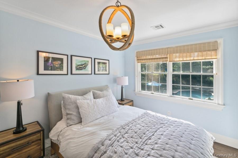 39 Smugglers Path Riverhead, NY 11901 - Photo 28 of 48 a bedroom with a bed and a window