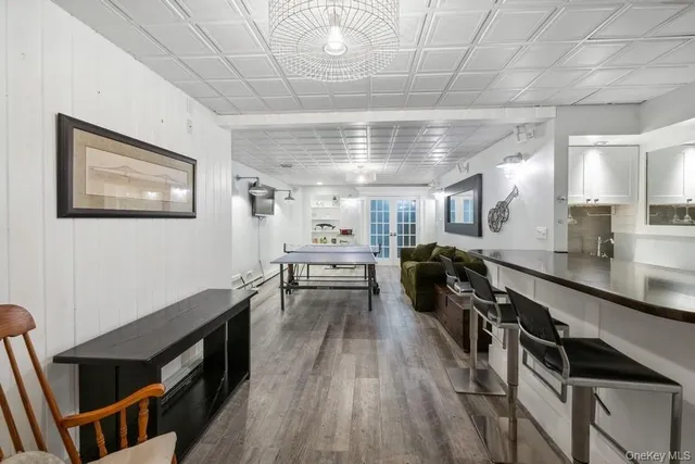 a kitchen with a sink a stove and cabinets