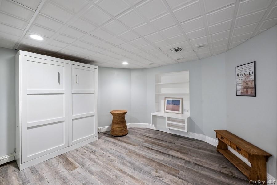 39 Smugglers Path Riverhead, NY 11901 - Photo 31 of 47 a view of an empty room with a window