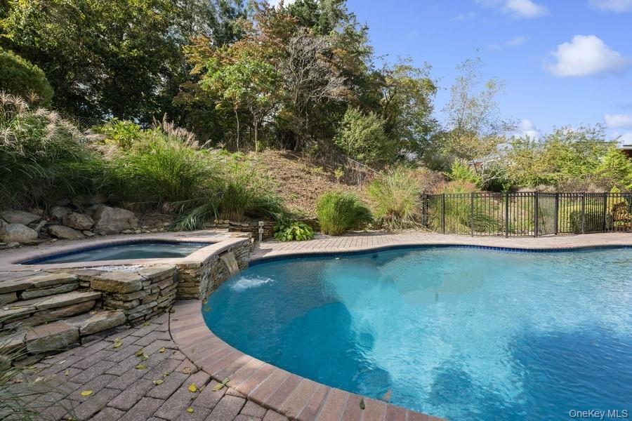 39 Smugglers Path Riverhead, NY 11901 - Photo 41 of 47 a view of a swimming pool with an outdoor space