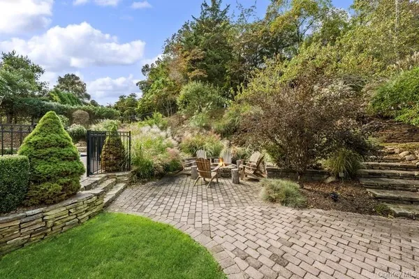 a view of backyard with sitting area