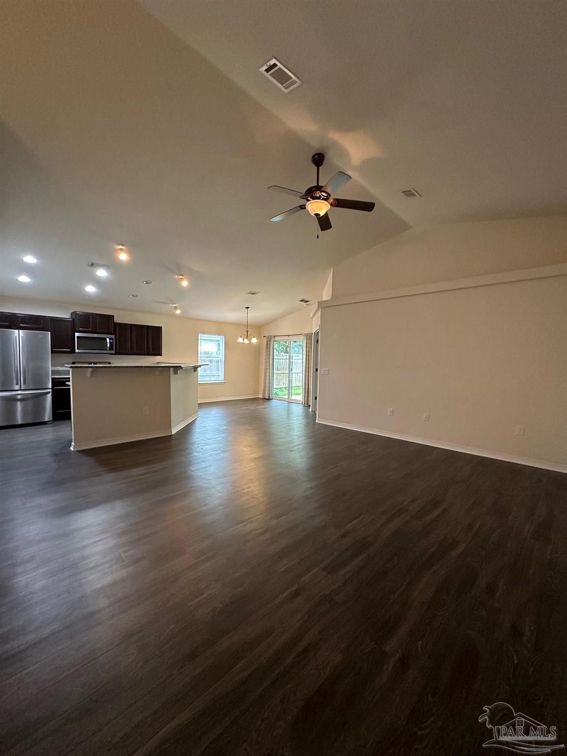 5933 Fairlands Road Milton, FL 32583 - Photo 2 of 16 a view of empty room with wooden floor