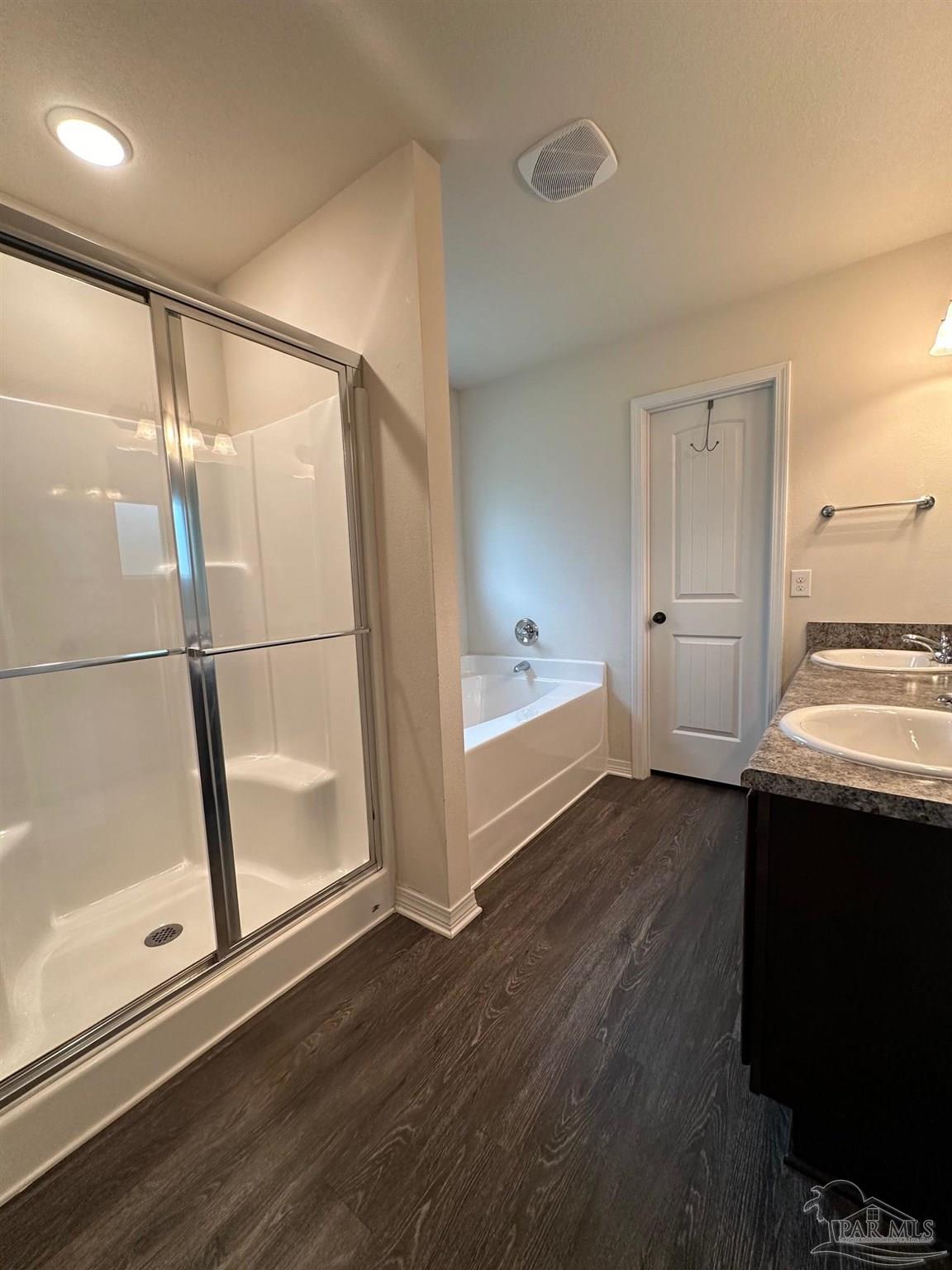 5933 Fairlands Road Milton, FL 32583 - Photo 7 of 16 a view of empty room with wooden floor and fan