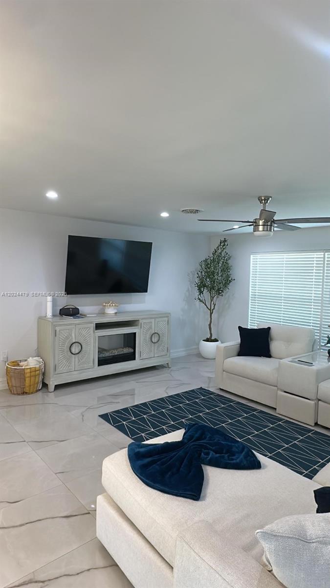 2212 Club House Road North Fort Myers, FL 33917 - Photo 8 of 40 a living room with furniture and a flat screen tv