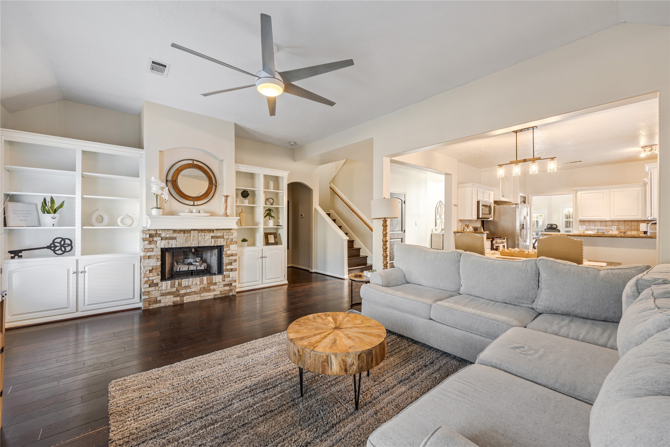 23106 Oxbow Trail Spring, TX 77373 - Photo 20 of 43 a living room with furniture a fireplace and wooden floor