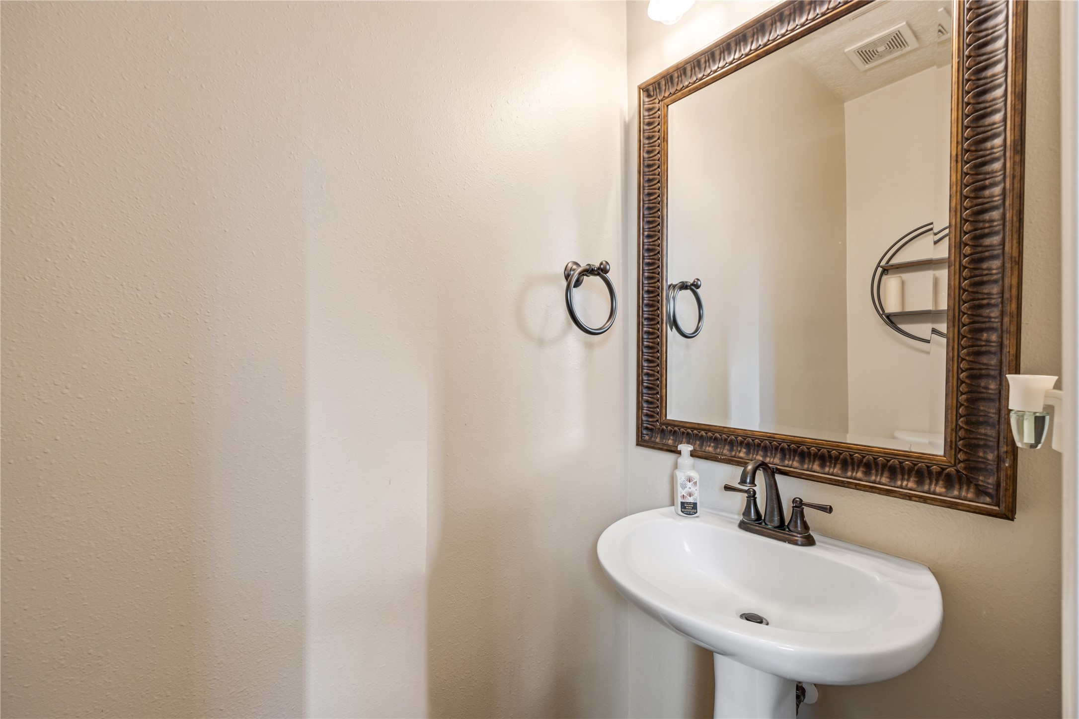23106 Oxbow Trail Spring, TX 77373 - Photo 21 of 43 a bathroom with a sink and a mirror