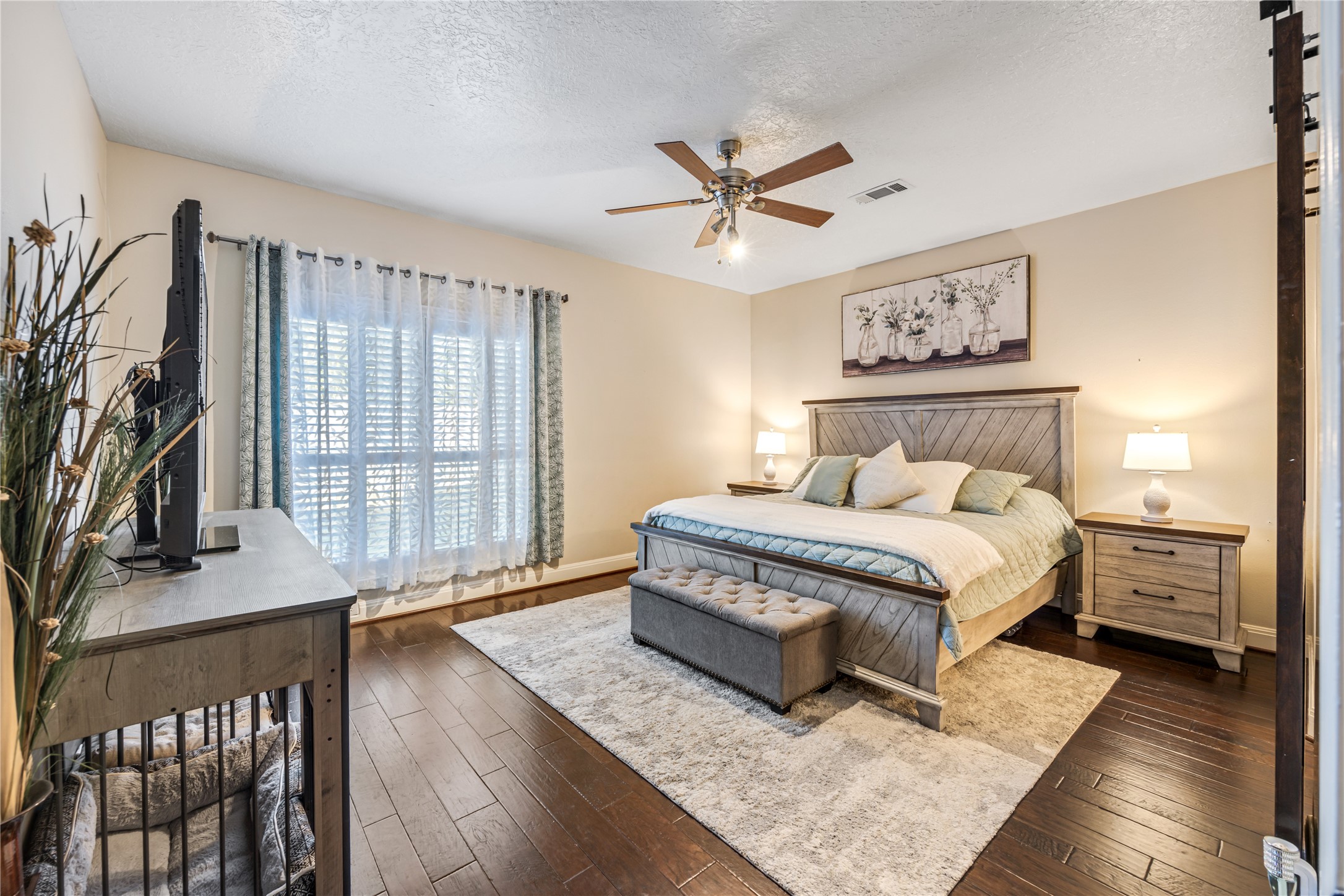 23106 Oxbow Trail Spring, TX 77373 - Photo 23 of 43 a bedroom with a bed and a flat screen tv