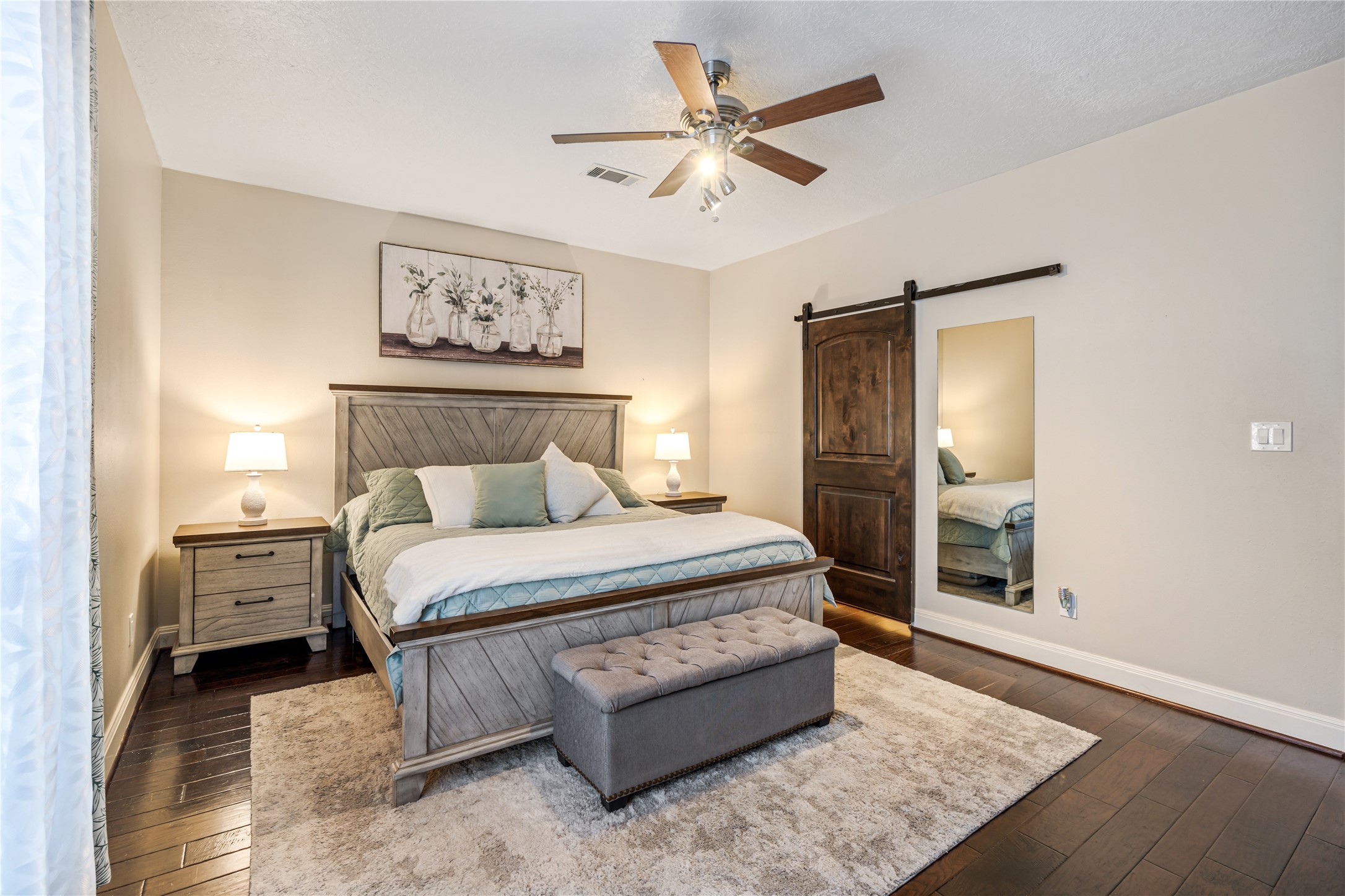 23106 Oxbow Trail Spring, TX 77373 - Photo 24 of 43 a bedroom with a bed and a chandelier