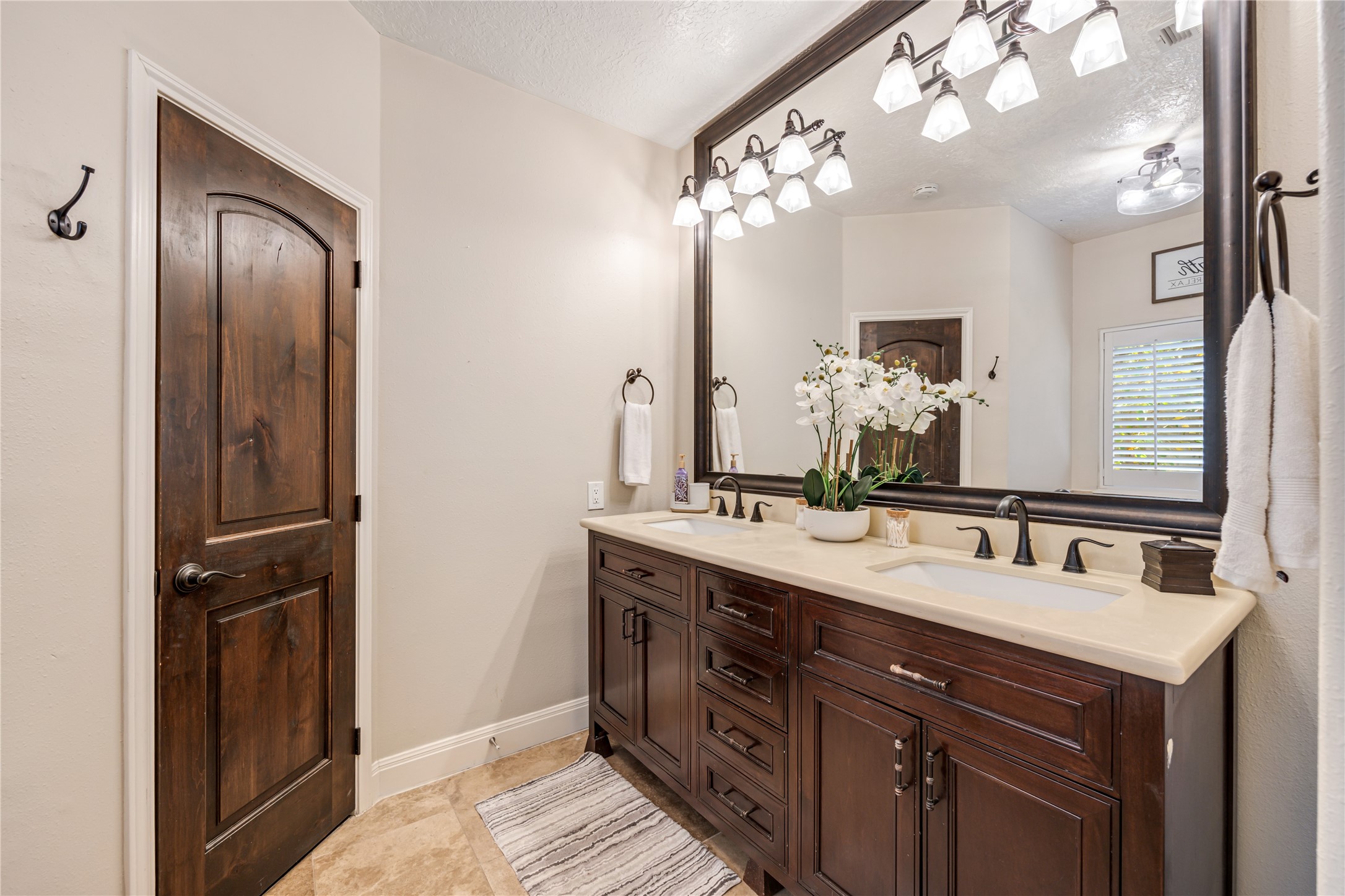 23106 Oxbow Trail Spring, TX 77373 - Photo 27 of 43 a bathroom with a double vanity sink and a mirror