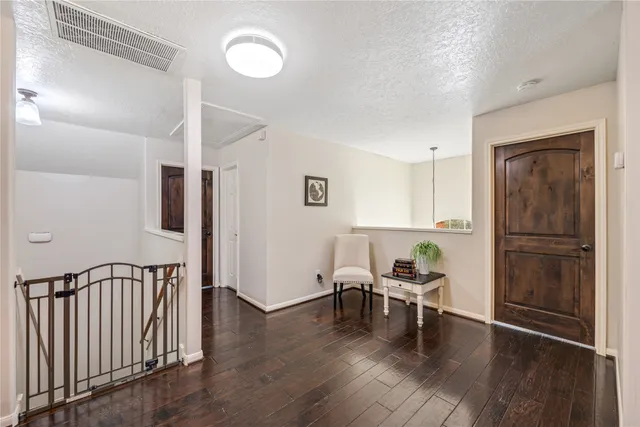 a view of a patio with a table and chairs