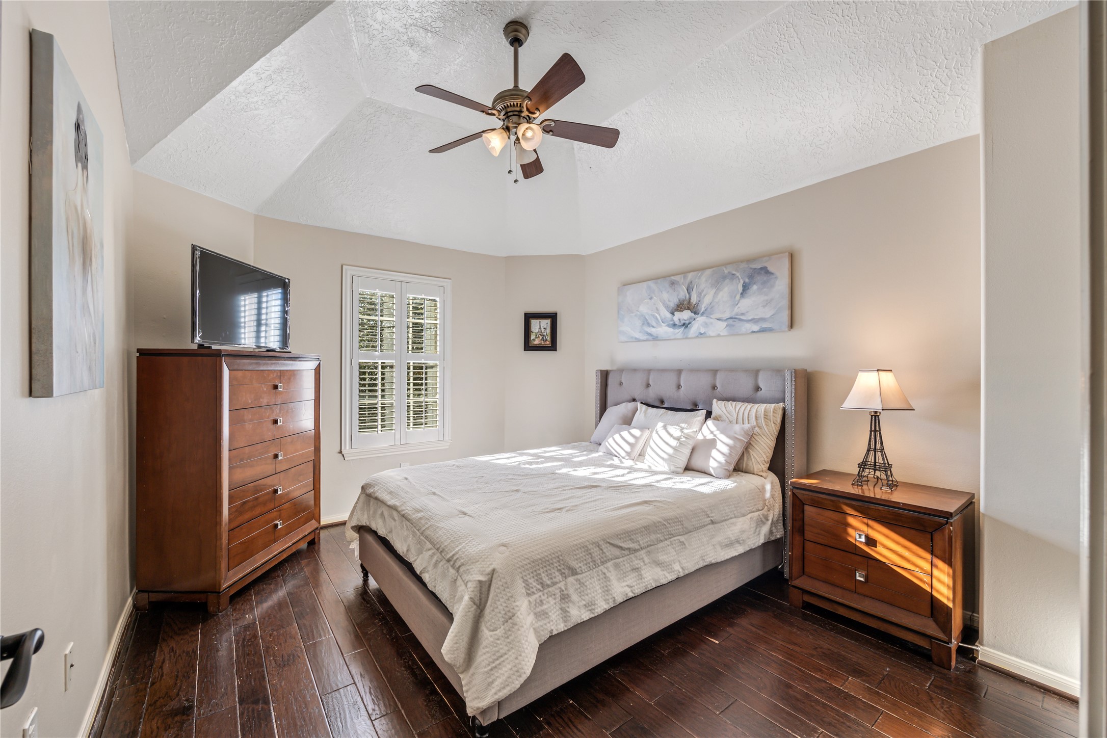 23106 Oxbow Trail Spring, TX 77373 - Photo 31 of 43 a bedroom with a large bed a flat tv screen and dresser