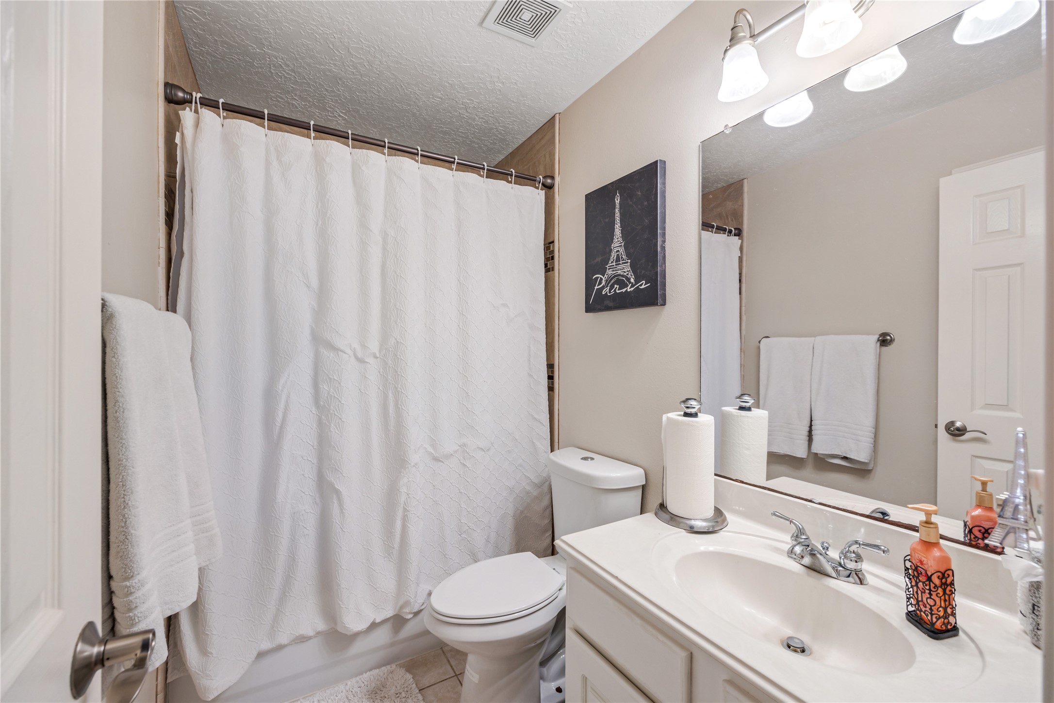 23106 Oxbow Trail Spring, TX 77373 - Photo 33 of 43 a bathroom with a sink a toilet and a mirror
