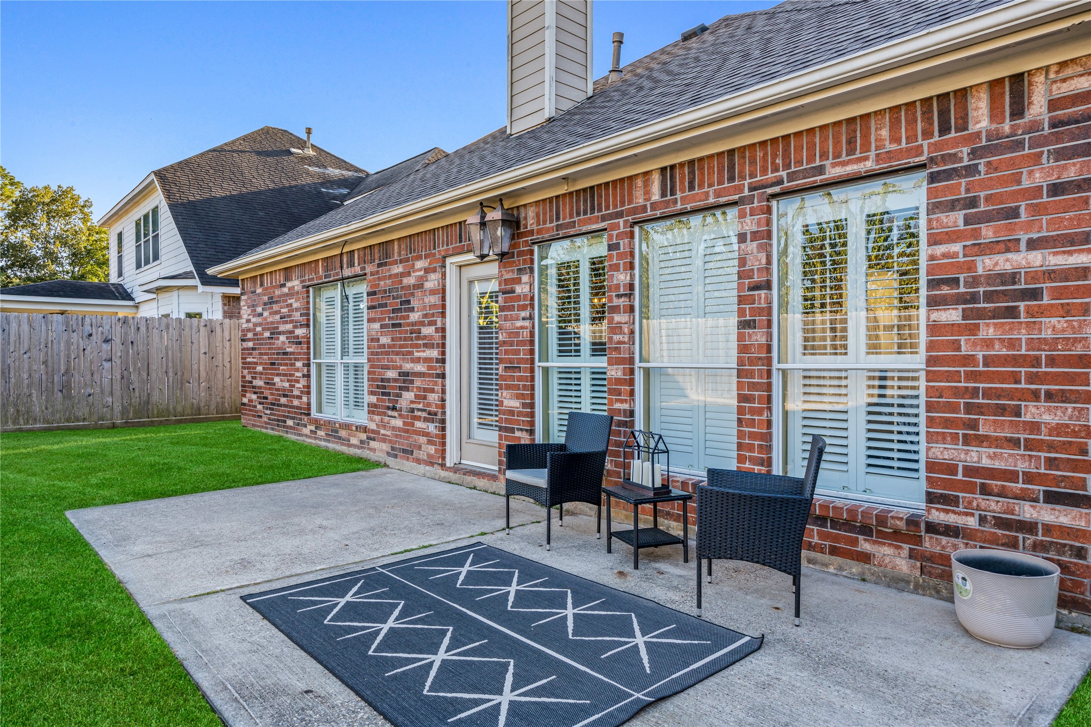 23106 Oxbow Trail Spring, TX 77373 - Photo 35 of 43 a view of a patio with a table and chairs