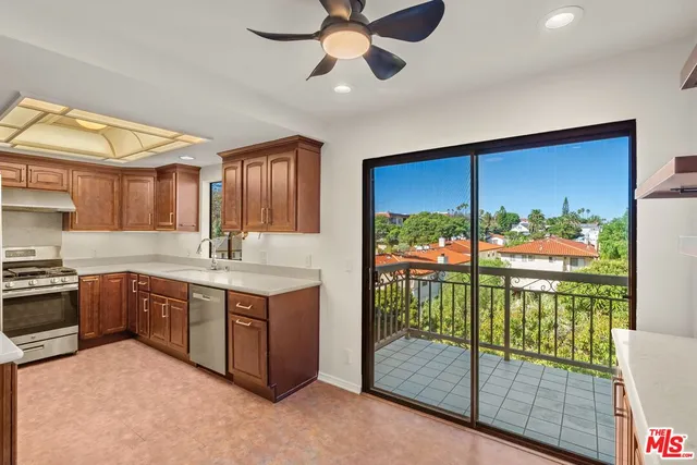 a kitchen with stainless steel appliances granite countertop a stove and a sink