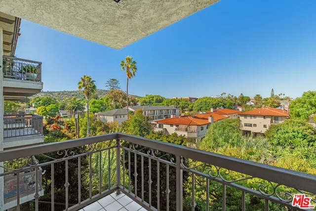 a view of a city skyline from a balcony