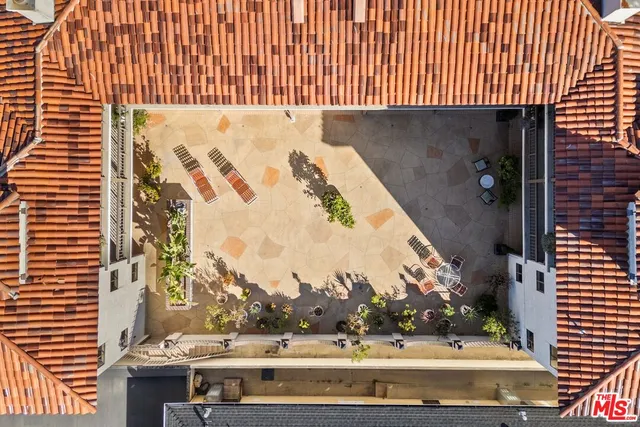 a view of parking garage with cars and a car