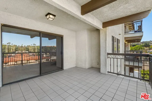 a view of a living room and a balcony