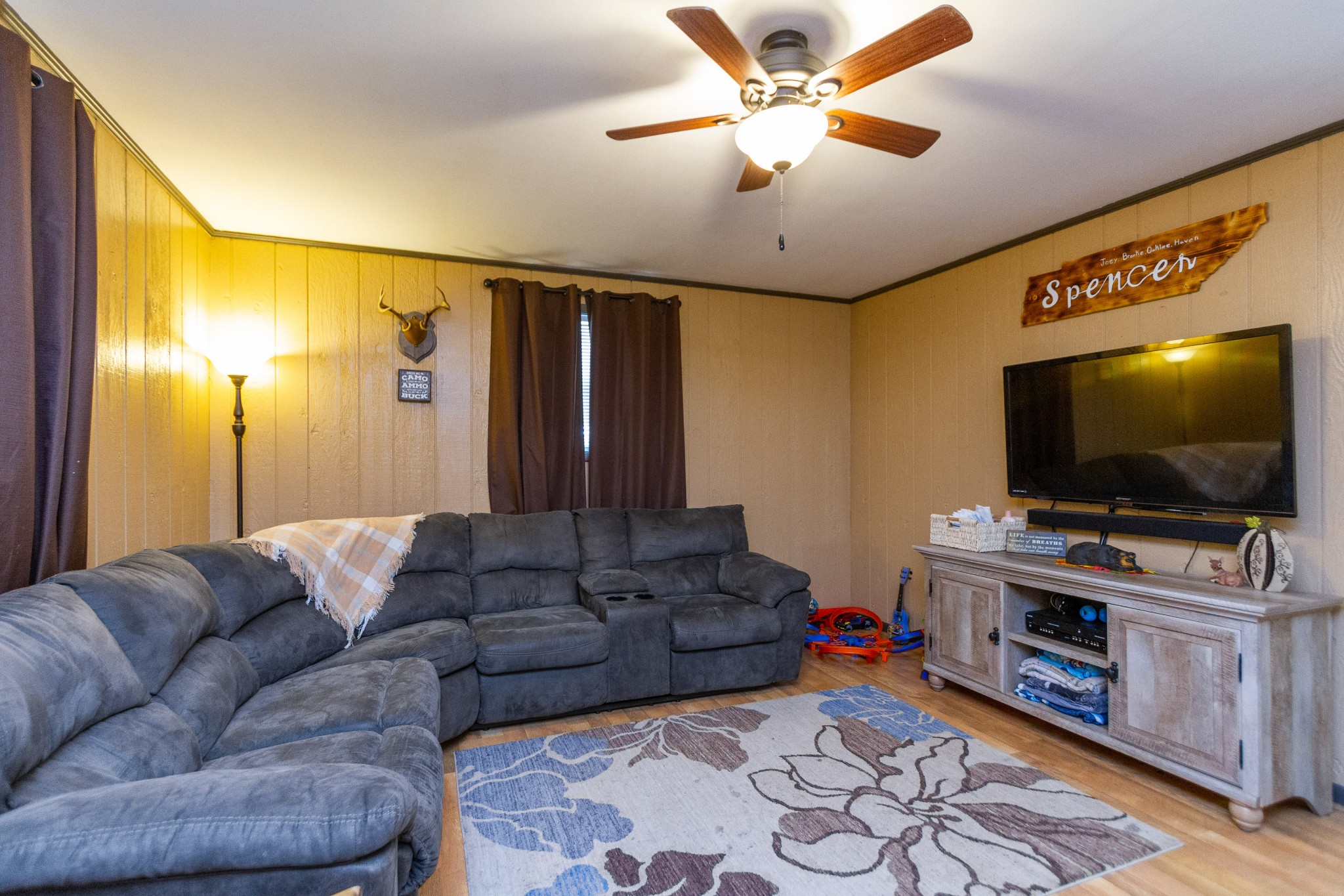 1940 Austin Road Lafayette, TN 37083 - Photo 11 of 41 a living room with furniture and a flat screen tv