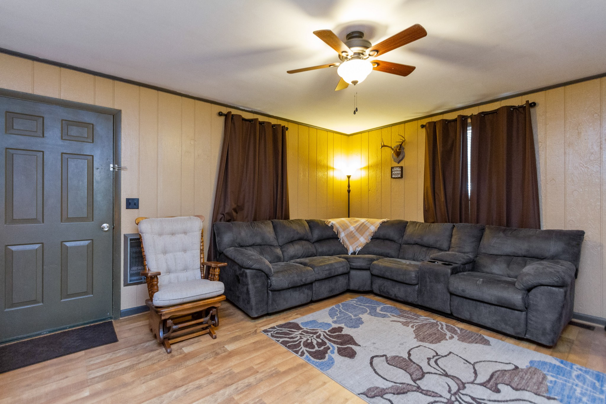 1940 Austin Road Lafayette, TN 37083 - Photo 13 of 41 a living room with furniture a ceiling fan and a rug