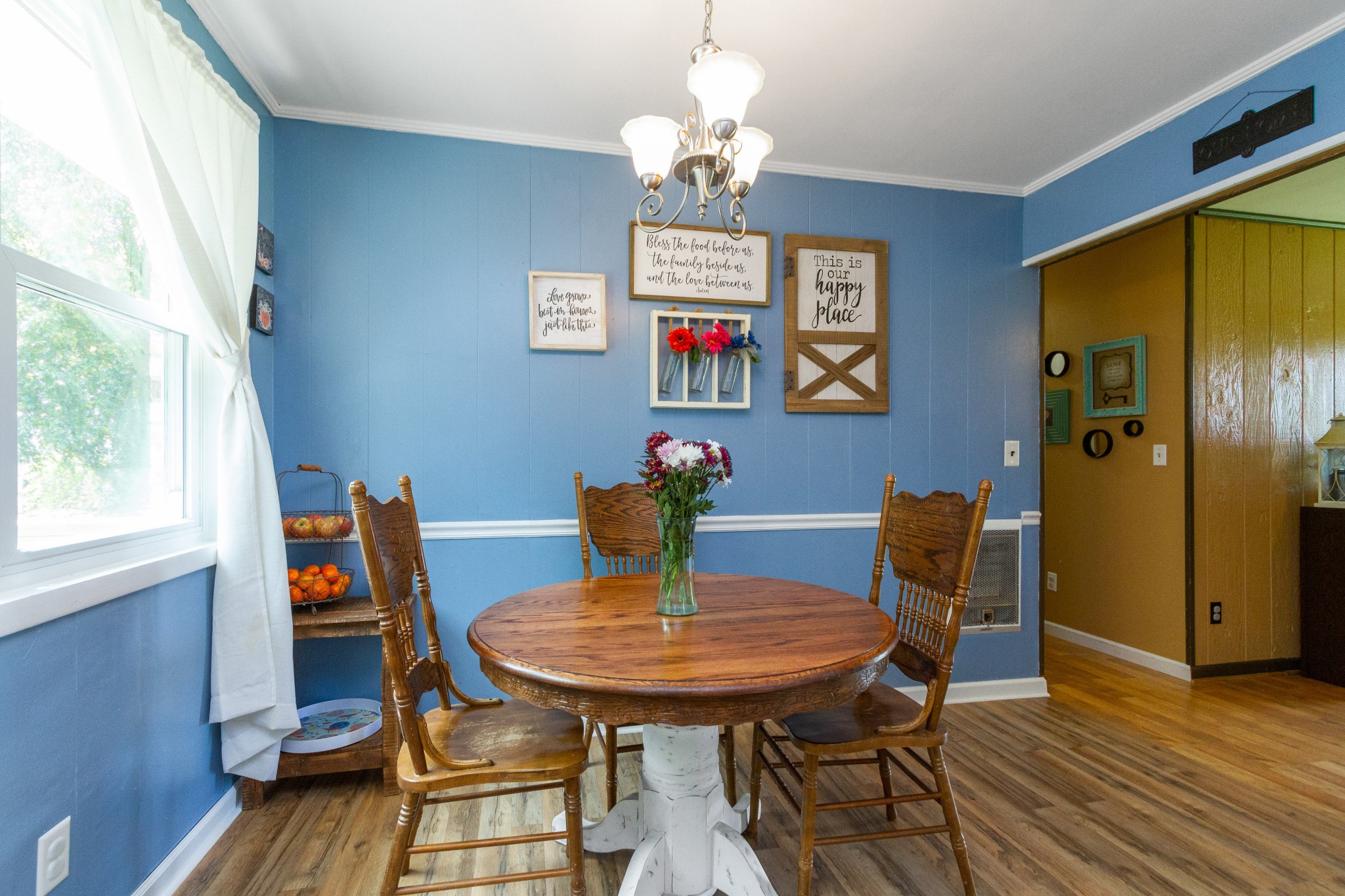 1940 Austin Road Lafayette, TN 37083 - Photo 17 of 41 a view of a dining room with furniture wooden floor and a chandelier
