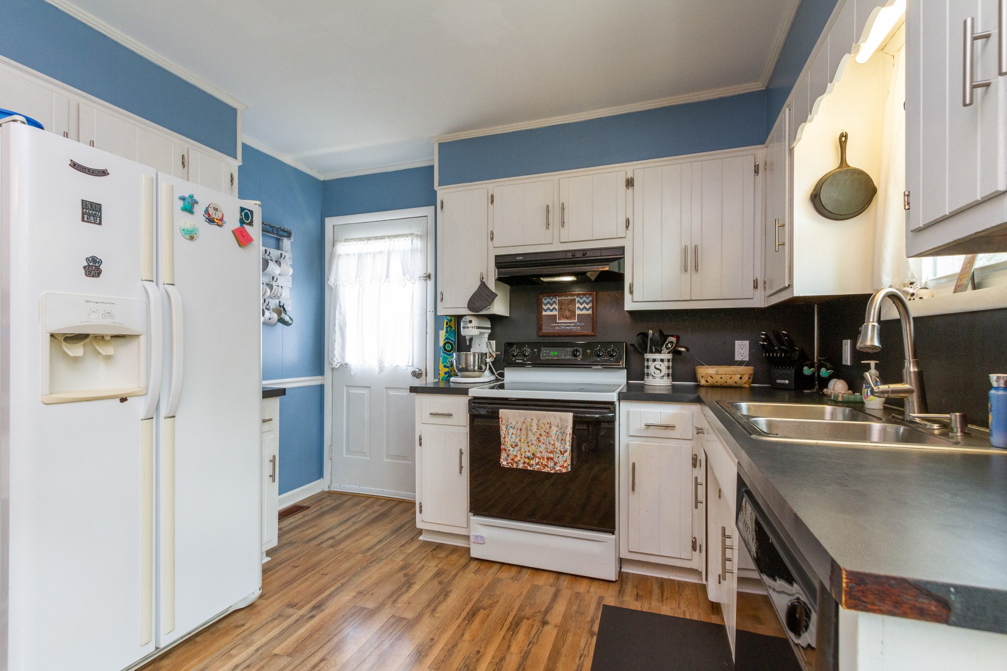 1940 Austin Road Lafayette, TN 37083 - Photo 22 of 41 a kitchen with stainless steel appliances a stove a sink a refrigerator and cabinets